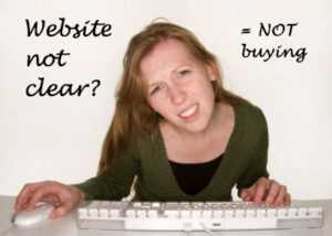 A woman is confused by the website she is looking at